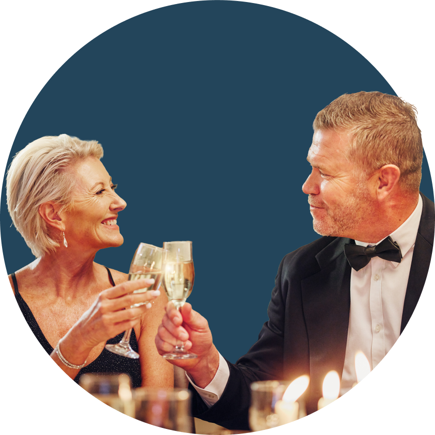 woman and man in formal attire toasting